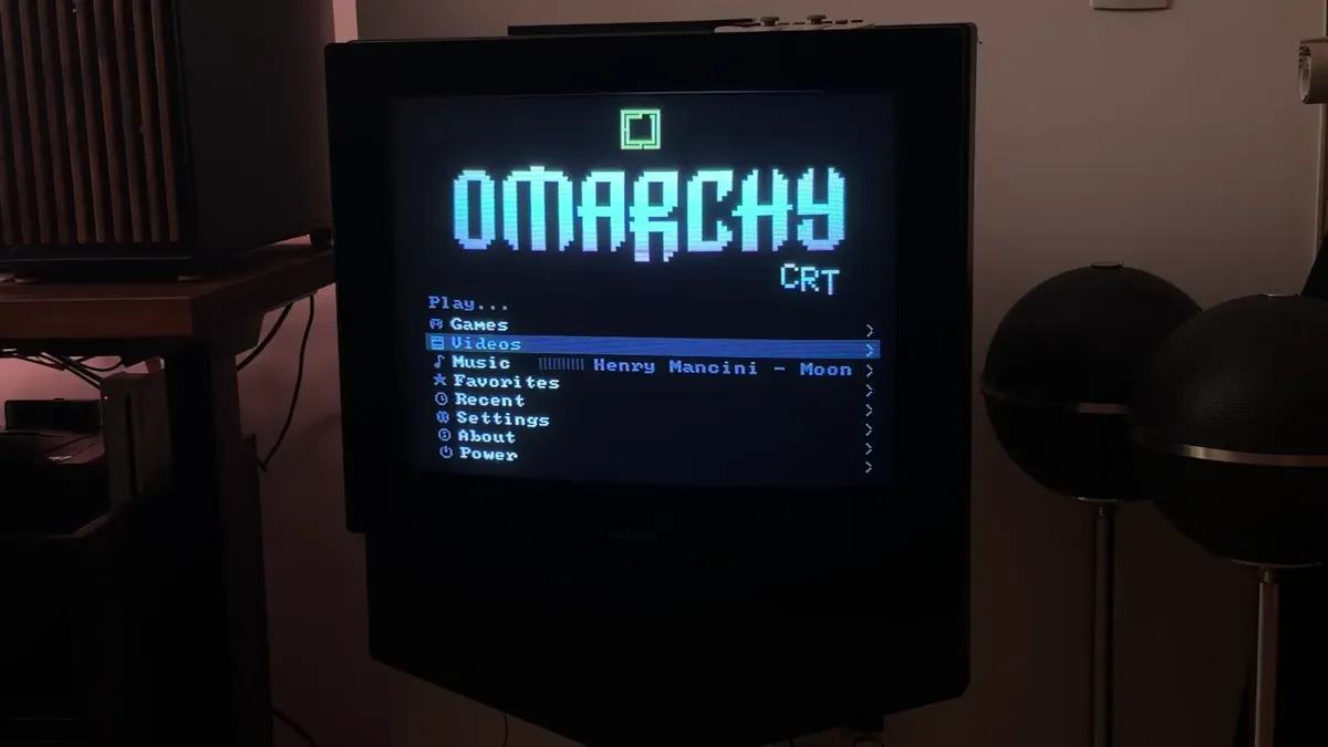 The same home menu photographed on the television, with real scanlines and phosphor glow.