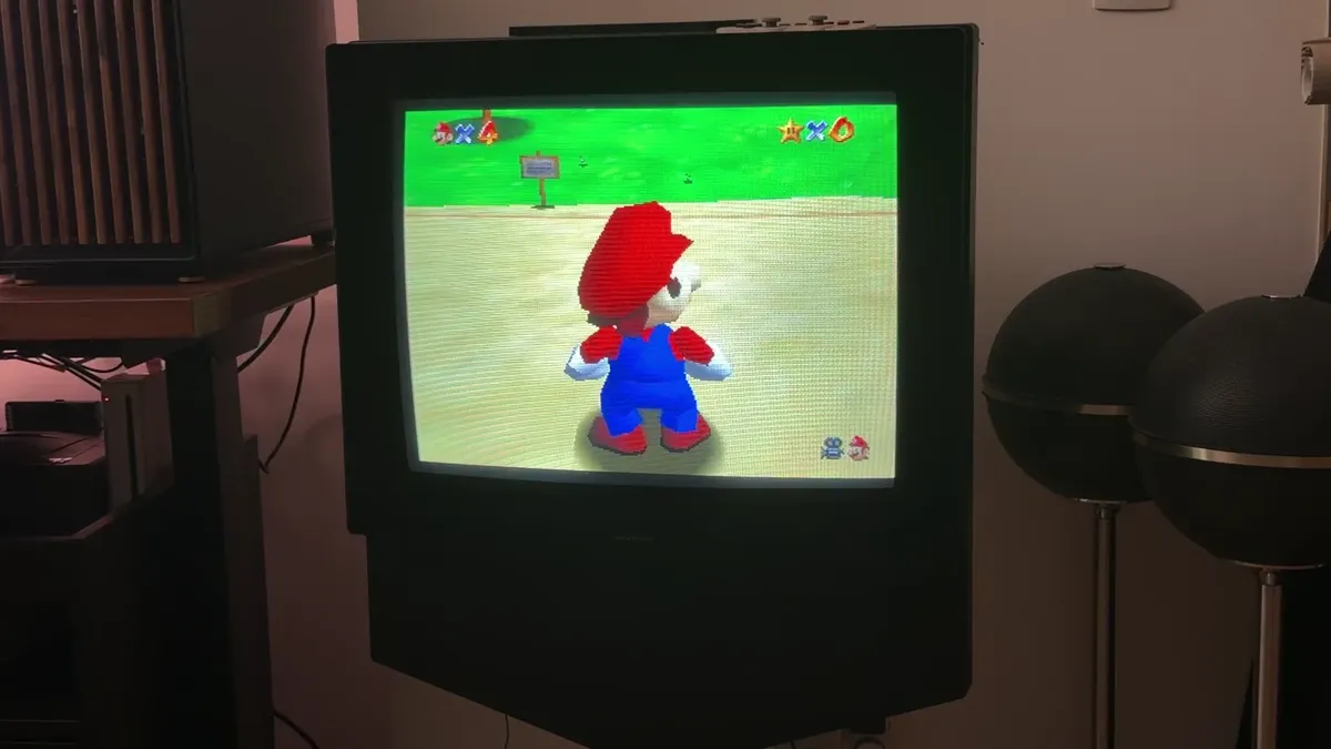 Super Mario 64 running on a cathode ray tube television.